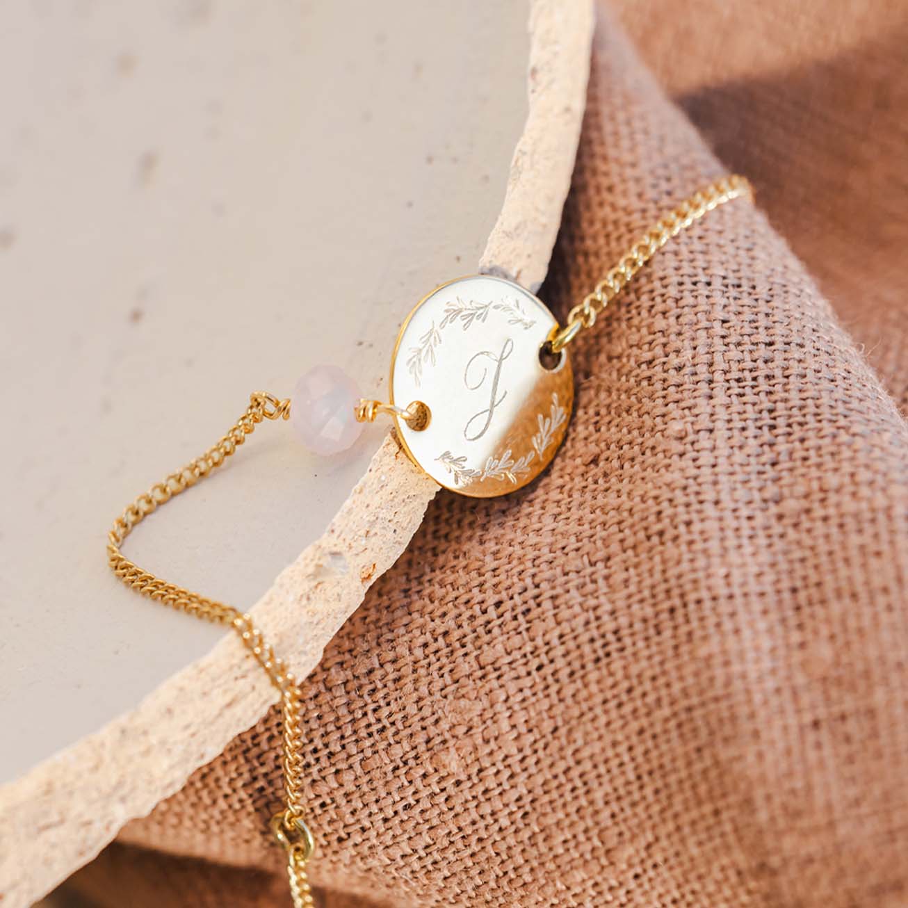 Christening bracelet with initial and faceted ston