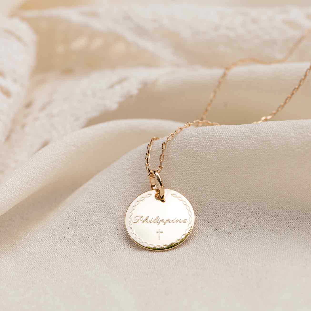 Christening necklace with a bordered frame