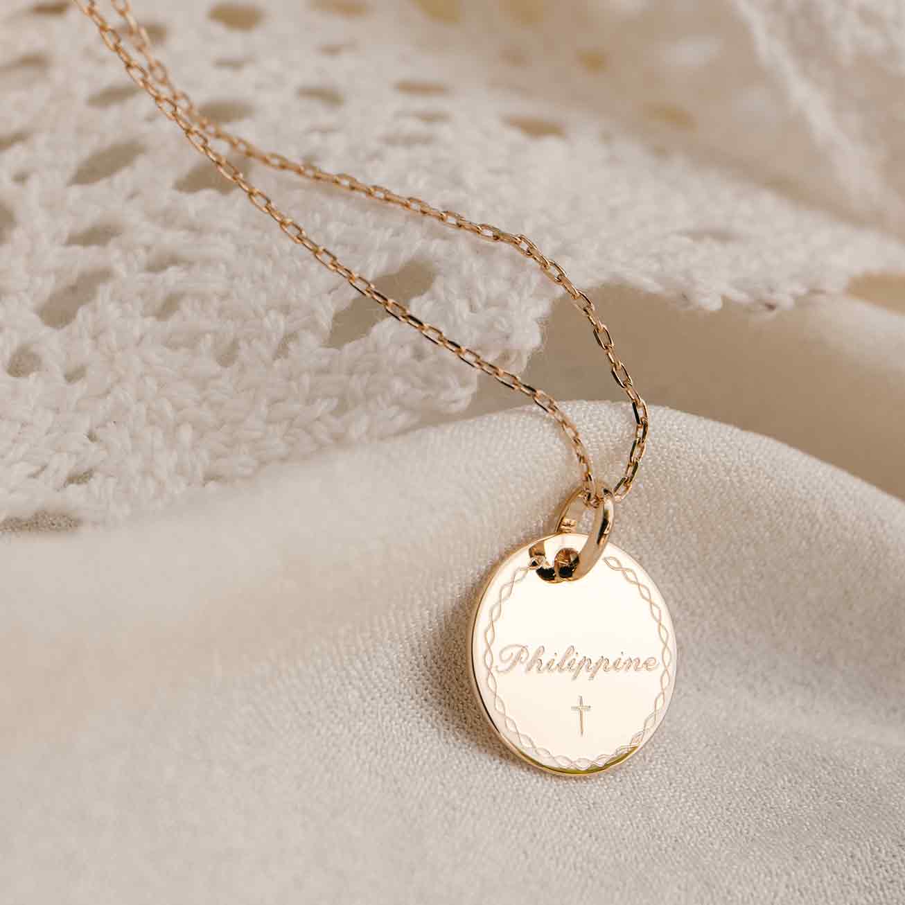 Christening necklace with a bordered frame