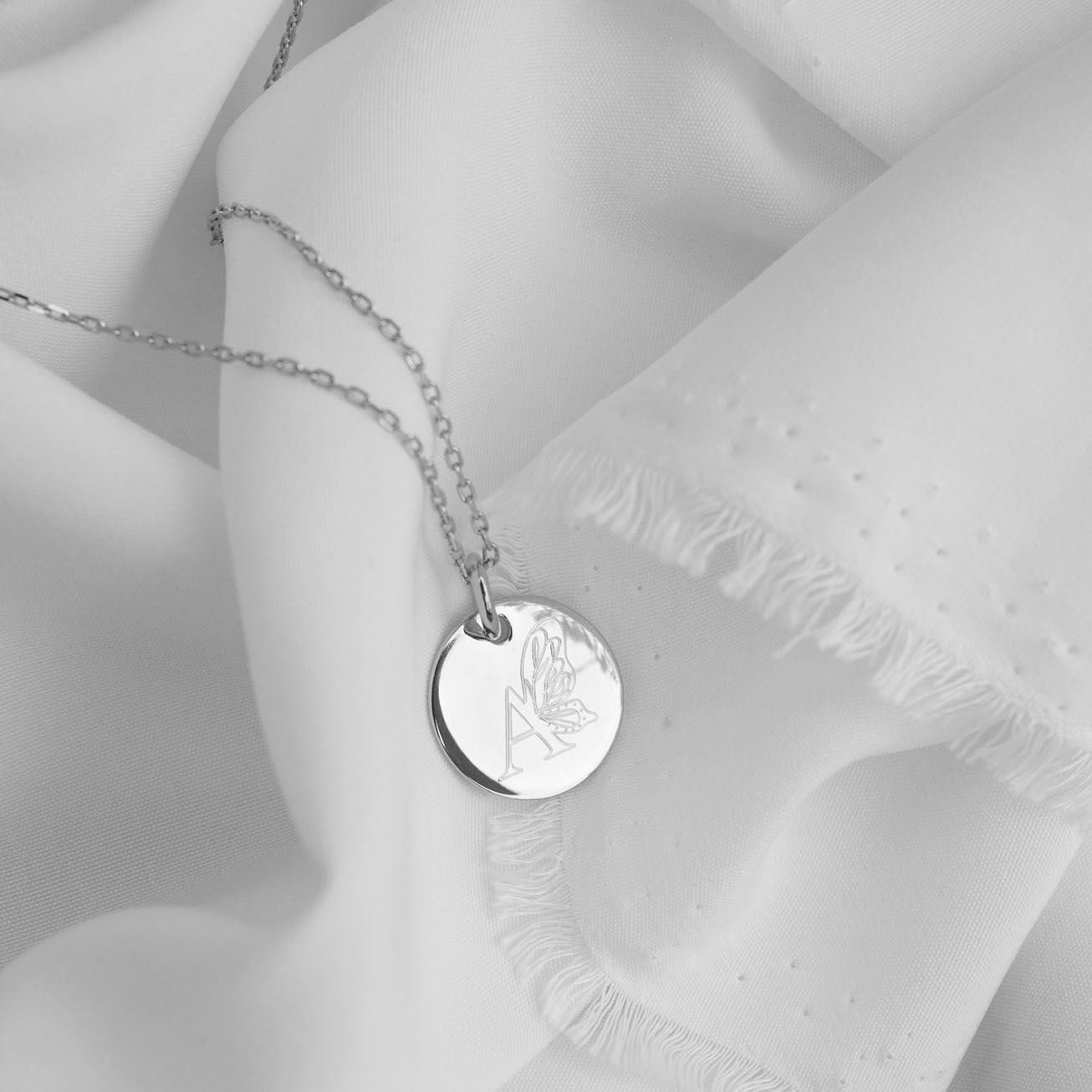 Personalised silver baptismal medal with butterfly