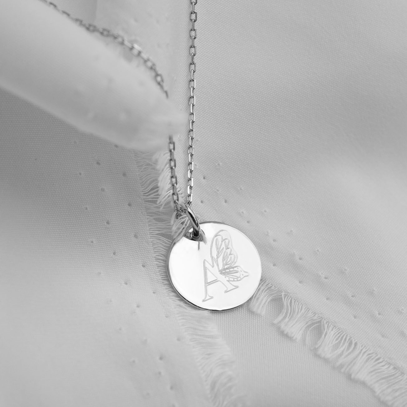 Personalised silver baptismal medal with butterfly