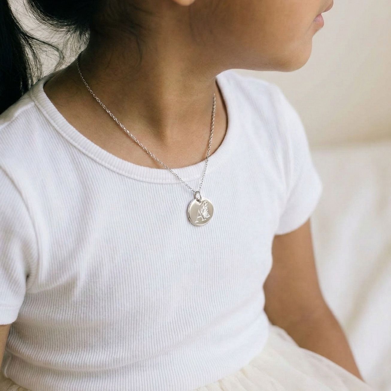 Personalised silver baptismal medal with butterfly